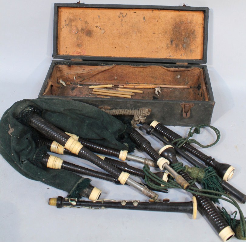 Appraisal: A cased set of bagpipes with various turned wooden pieces