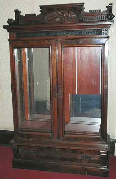 Appraisal: Eastlake carved walnut bookcase with an ornate galleried top from