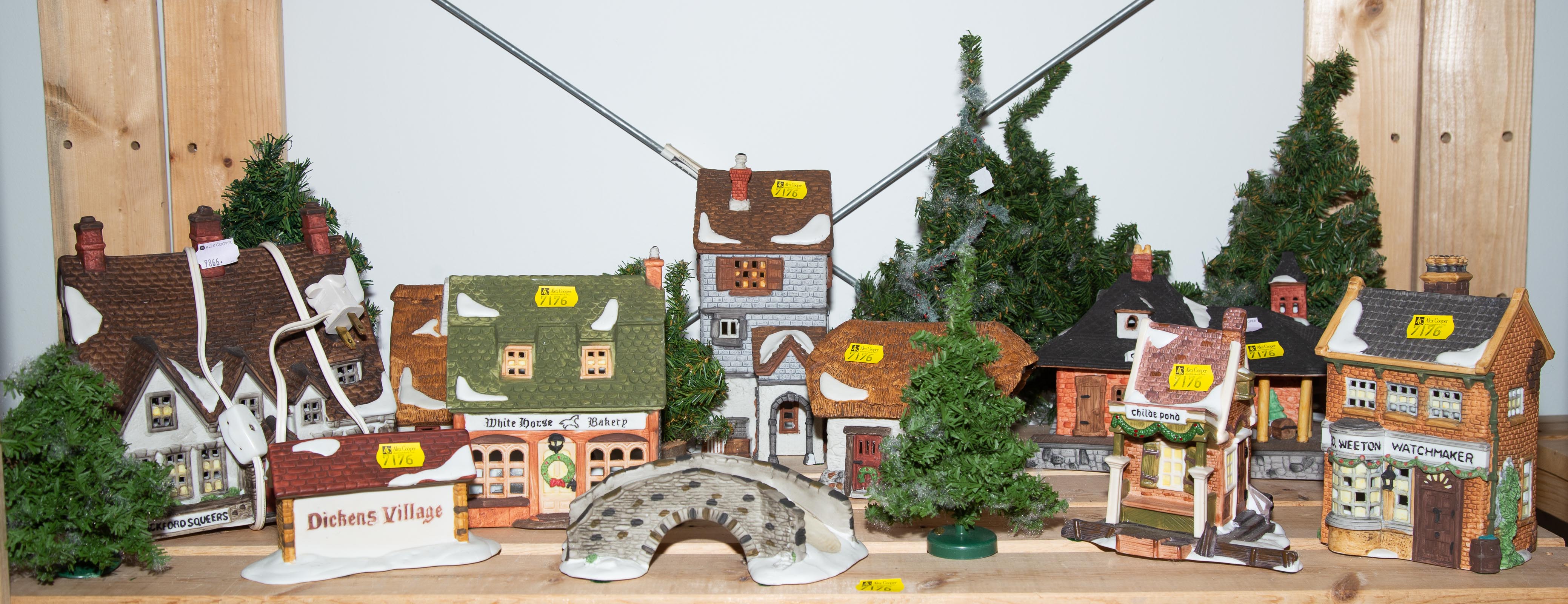 Appraisal: DICKENS VILLAGE DEPARTMENT PORCELAIN BUILDINGS Includes eight buildings Dickens Village