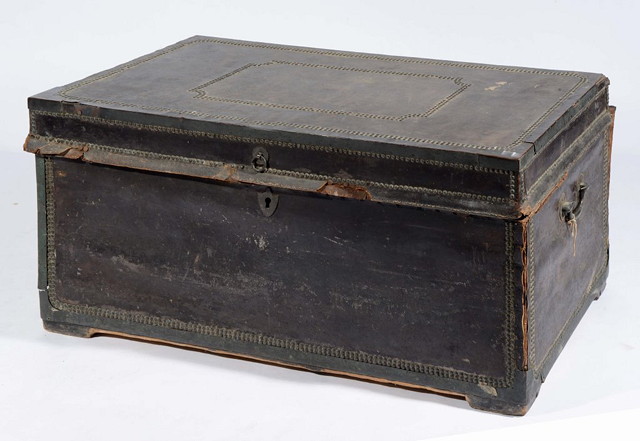 Appraisal: A GEORGIAN LEATHER BOUND TRUNK with brass bindings and studded