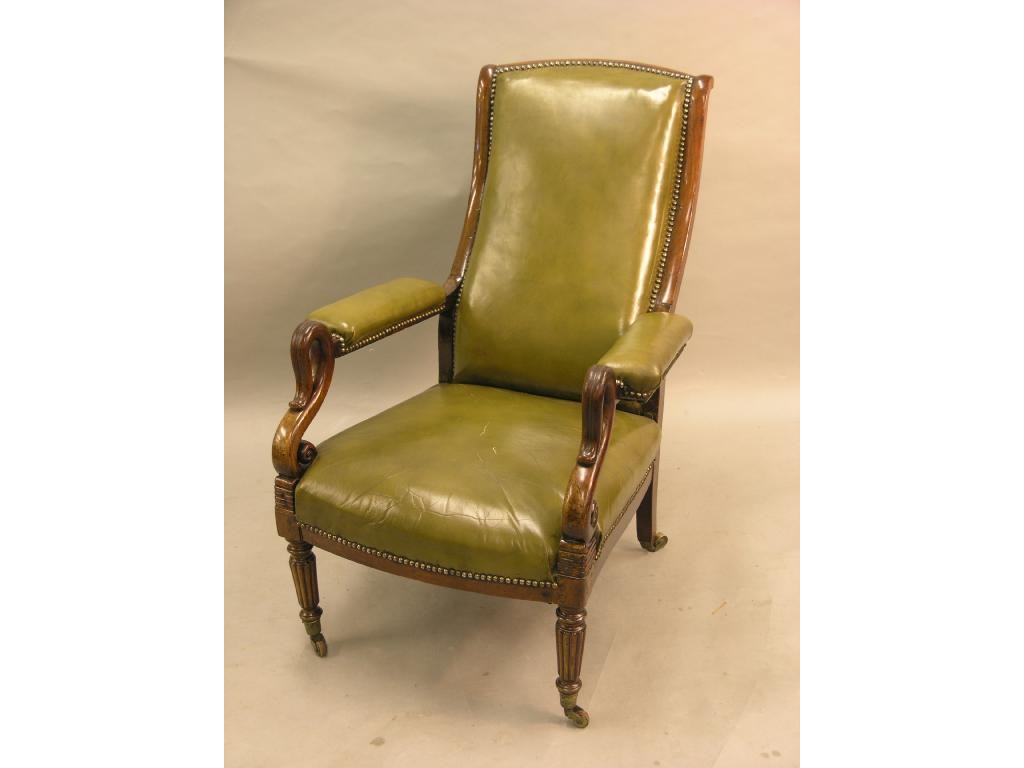 Appraisal: An early Victorian mahogany library armchair with carved swan-neck arm