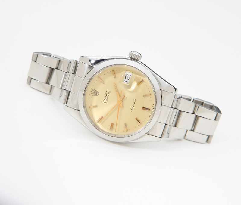 Appraisal: Champagne sunburst dial with gold tone baton markers signed 'Rolex