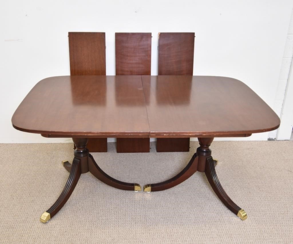 Appraisal: Mahogany double pedestal dining room table with brass cuffs th