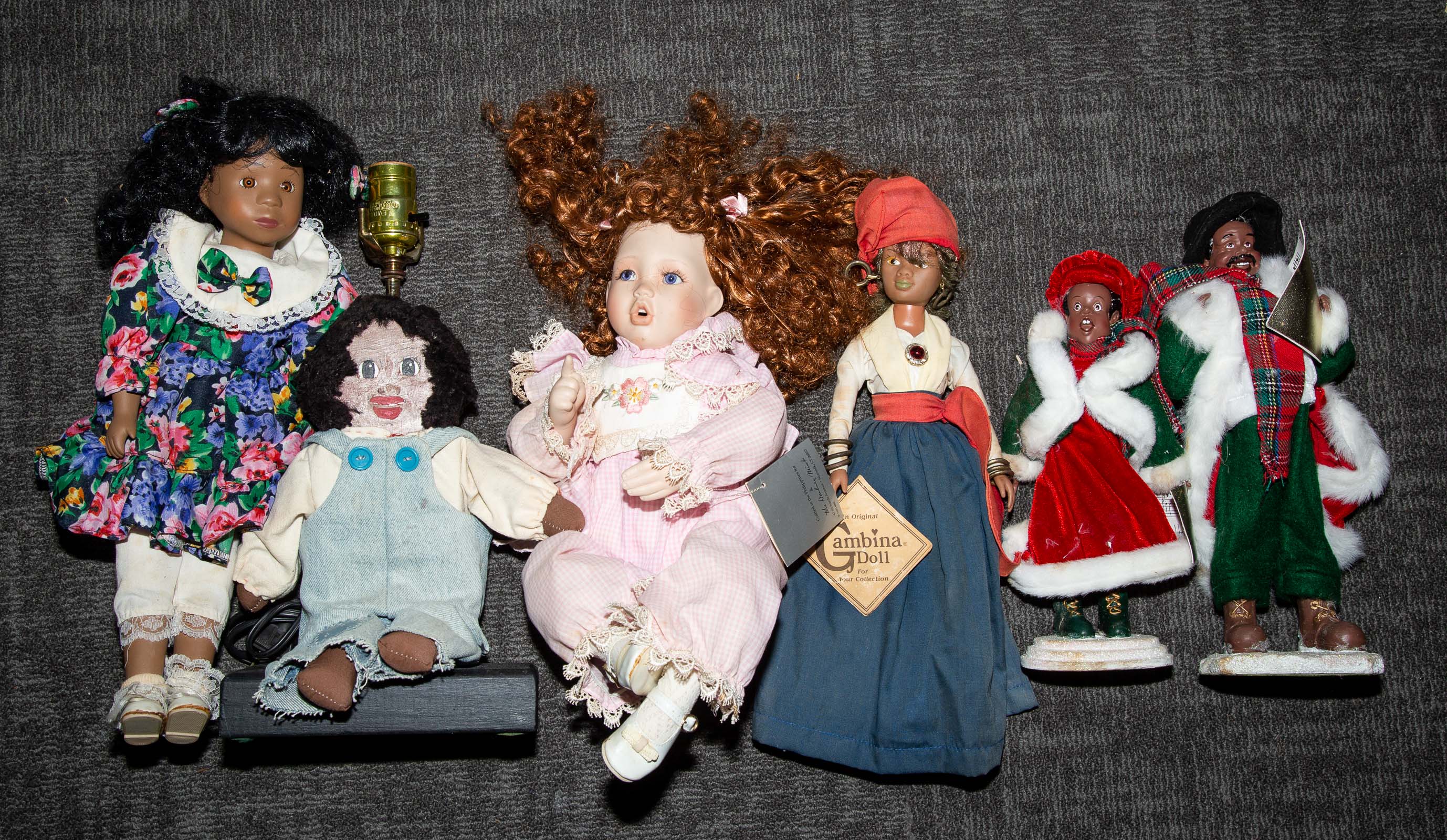 Appraisal: FIVE AFRICAN AMERICAN DOLLS Includes a pair of Christmas carolers