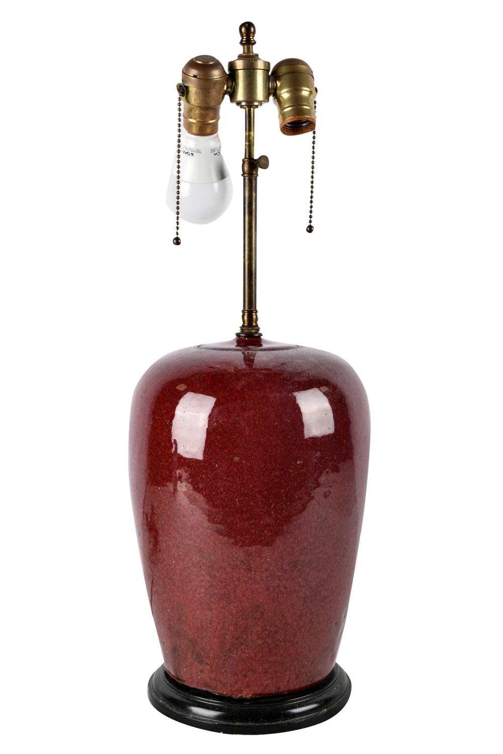 Appraisal: CHINESE OXBLOOD GLAZED JARmounted as a table lamp drilled Condition