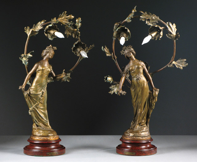 Appraisal: PAIR FRENCH ART NOUVEAU METAL FIGURAL LAMPS titled Porte Bonheur