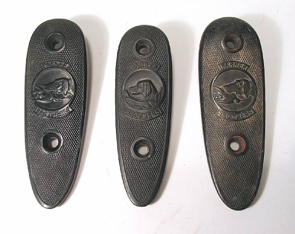 Appraisal: Three Parker hard rubber buttplates Checkered with maker's retriever vignettes