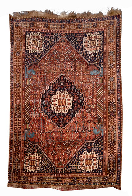 Appraisal: A QASHQAI RUST GROUND RUG with a central blue ground