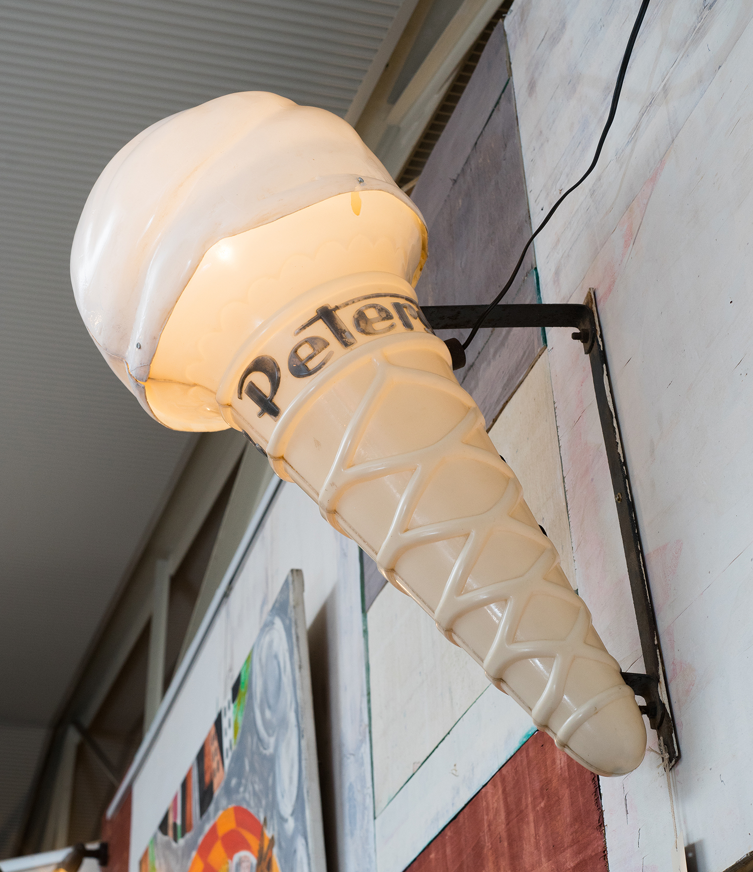 Appraisal: AN EARLY th CENTURY 'PETERS' ICE-CREAM CONE SIGN Plastic with