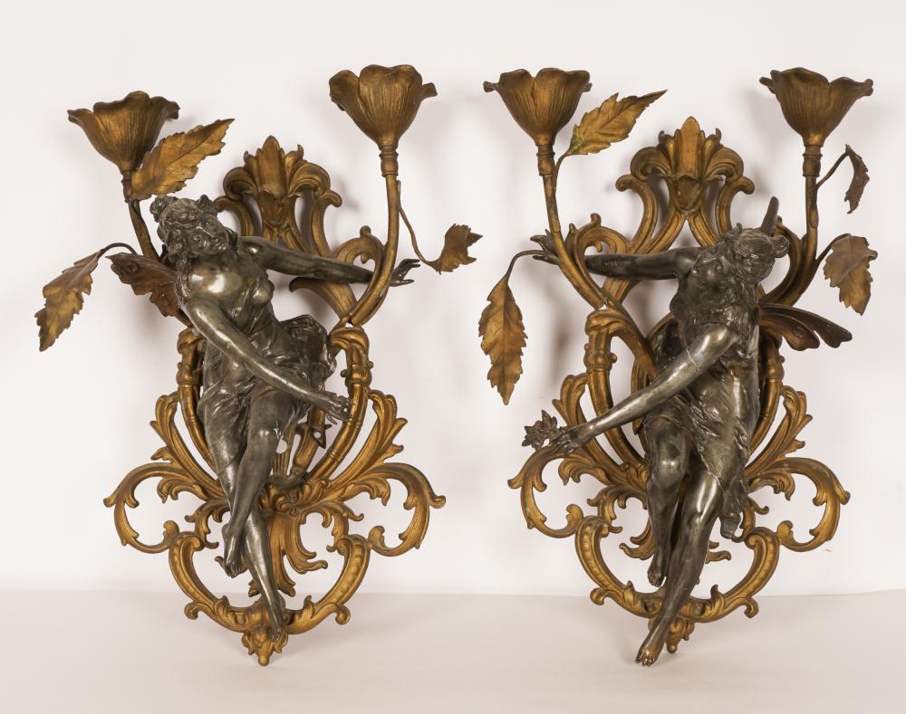 Appraisal: PAIR OF ROCOCO-STYLE FIGURAL WALL SCONCESsilt and patinated metal Condition