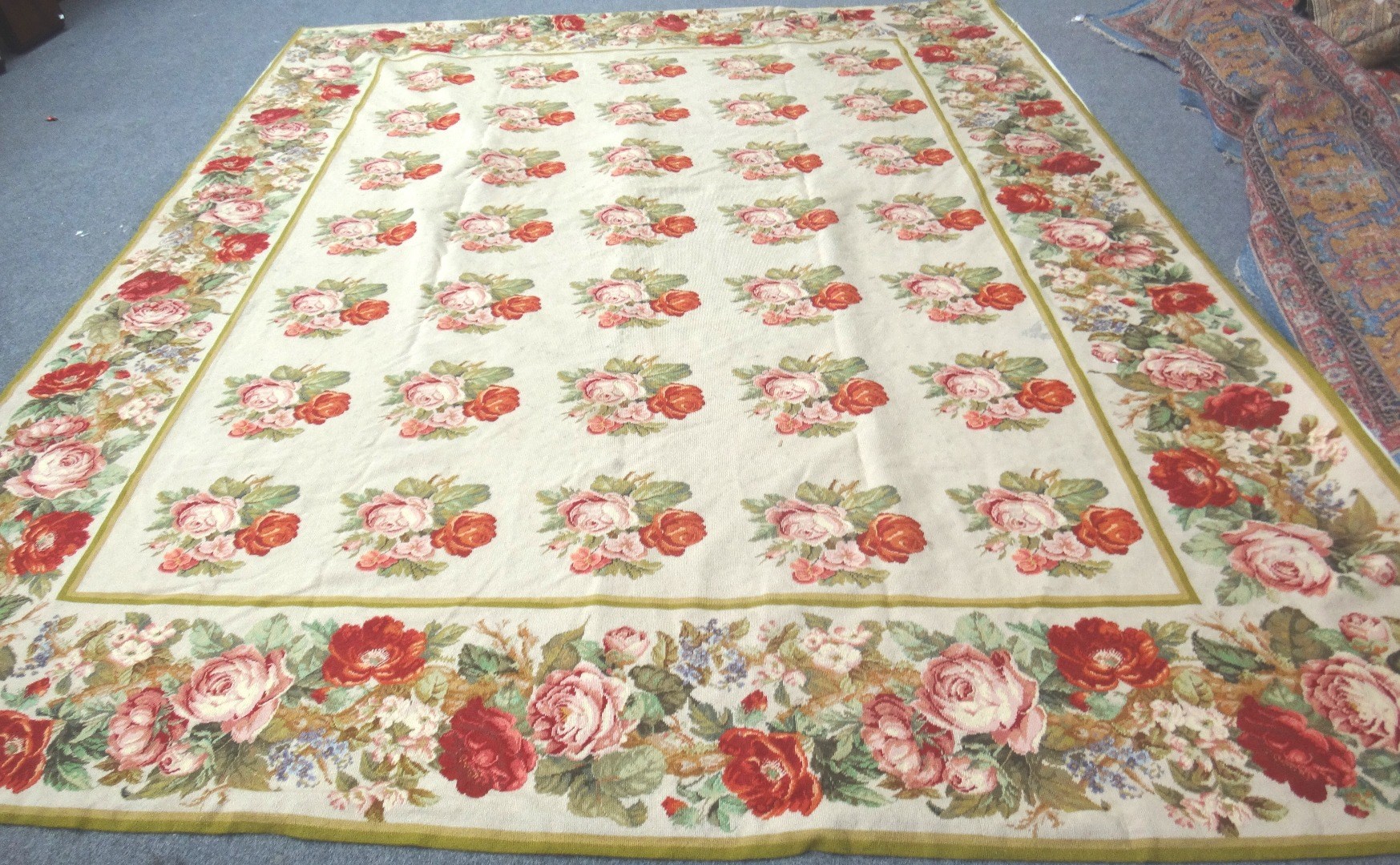 Appraisal: A Chinese needlepoint carpet the ivory field with rows of