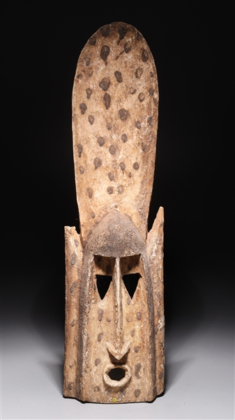 Appraisal: West African tribal mask carved from a single piece of