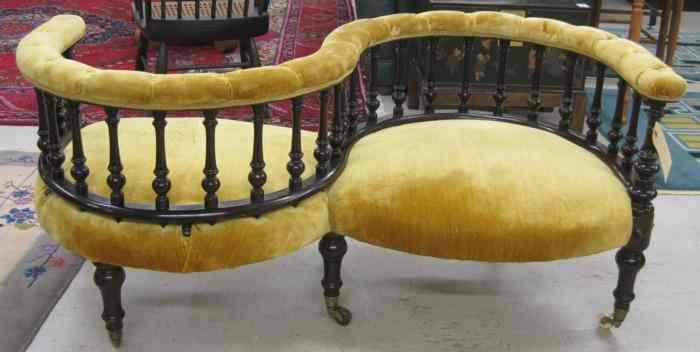 Appraisal: VICTORIAN TETE-A-TETE English th century the gold upholstered double armchair