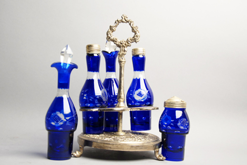 Appraisal: A Cobalt Blue Cut-to-Clear Castor Set in a silverplated stand