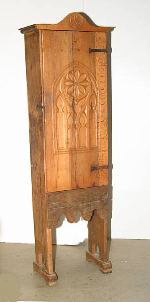 Appraisal: A pair of Spanish Gothic style oak cupboards partially composed