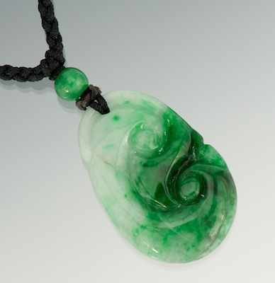 Appraisal: A Carved Jadeite Pendant Jadeite pendant carved in the shape