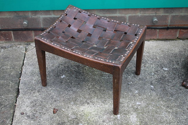 Appraisal: AN ARTS AND CRAFTS WALNUT STOOL in the manner of