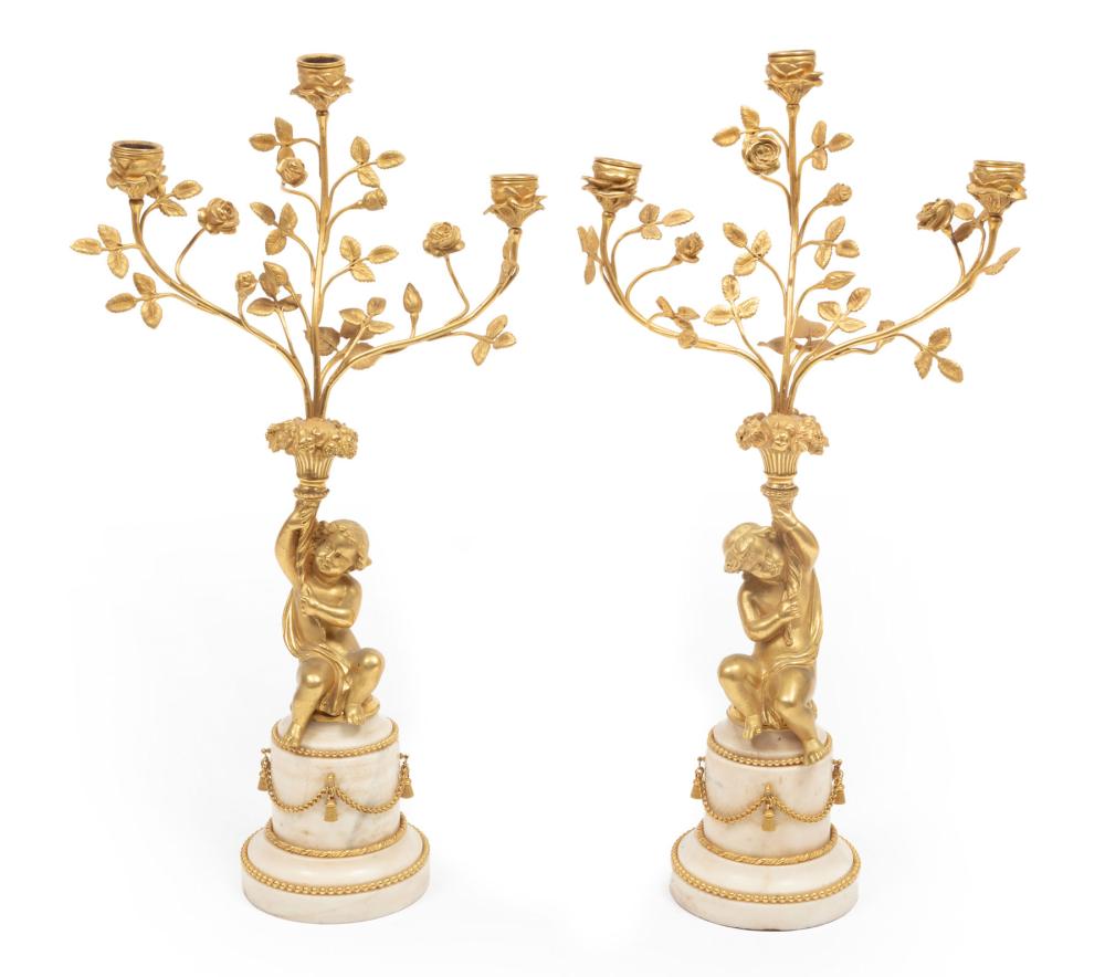 Appraisal: Pair of Empire-Style Gilt Bronze and Marble Three-Light Figural Candelabra