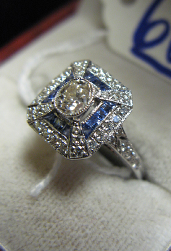 Appraisal: SAPPHIRE DIAMOND AND EIGHTEEN KARAT WHITE GOLD RING centered is