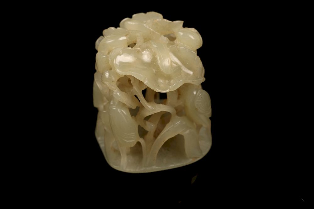 Appraisal: CELADON JADE RETICULATED 'EGRET' FINIAL YUAN DYNASTY Meticulously carved with