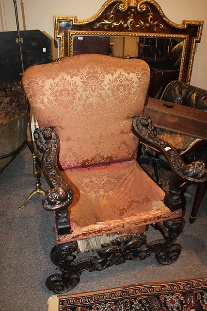 Appraisal: AN TH CENTURY ITALIANATE ARMCHAIR with carved supports and 'X'