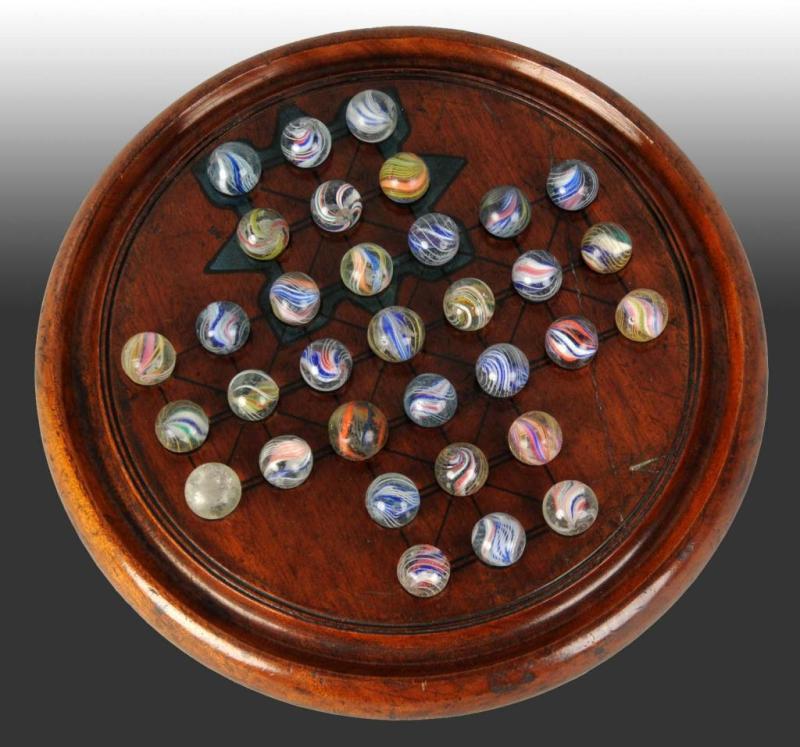 Appraisal: Solitaire Board Set Description This set includes marbles consisting of