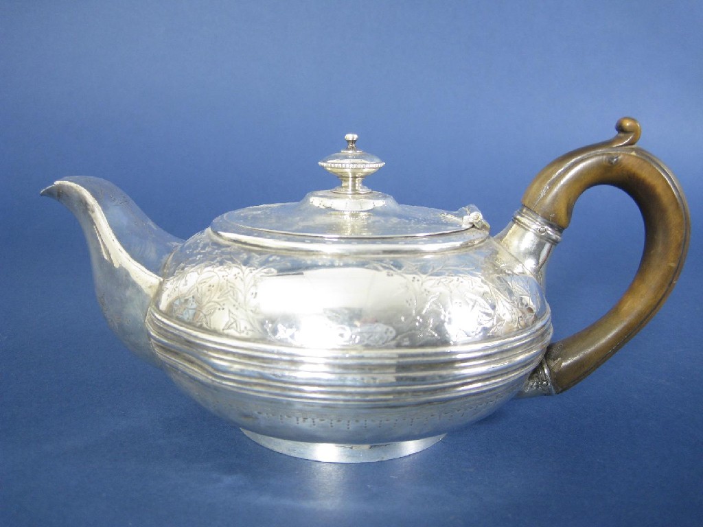 Appraisal: A George IV circular Teapot with leafage scroll engraving and