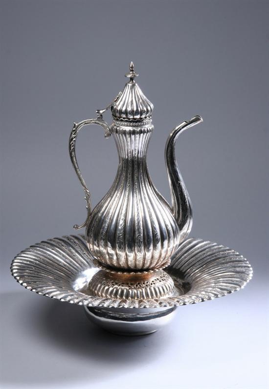 Appraisal: TURKISH SILVER EWER AND UNDERTRAY Of pear-shape repousse and chased