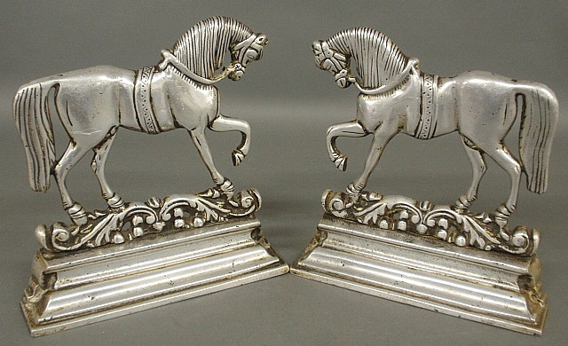 Appraisal: - Two cast aluminum prancing horse bookends c x -