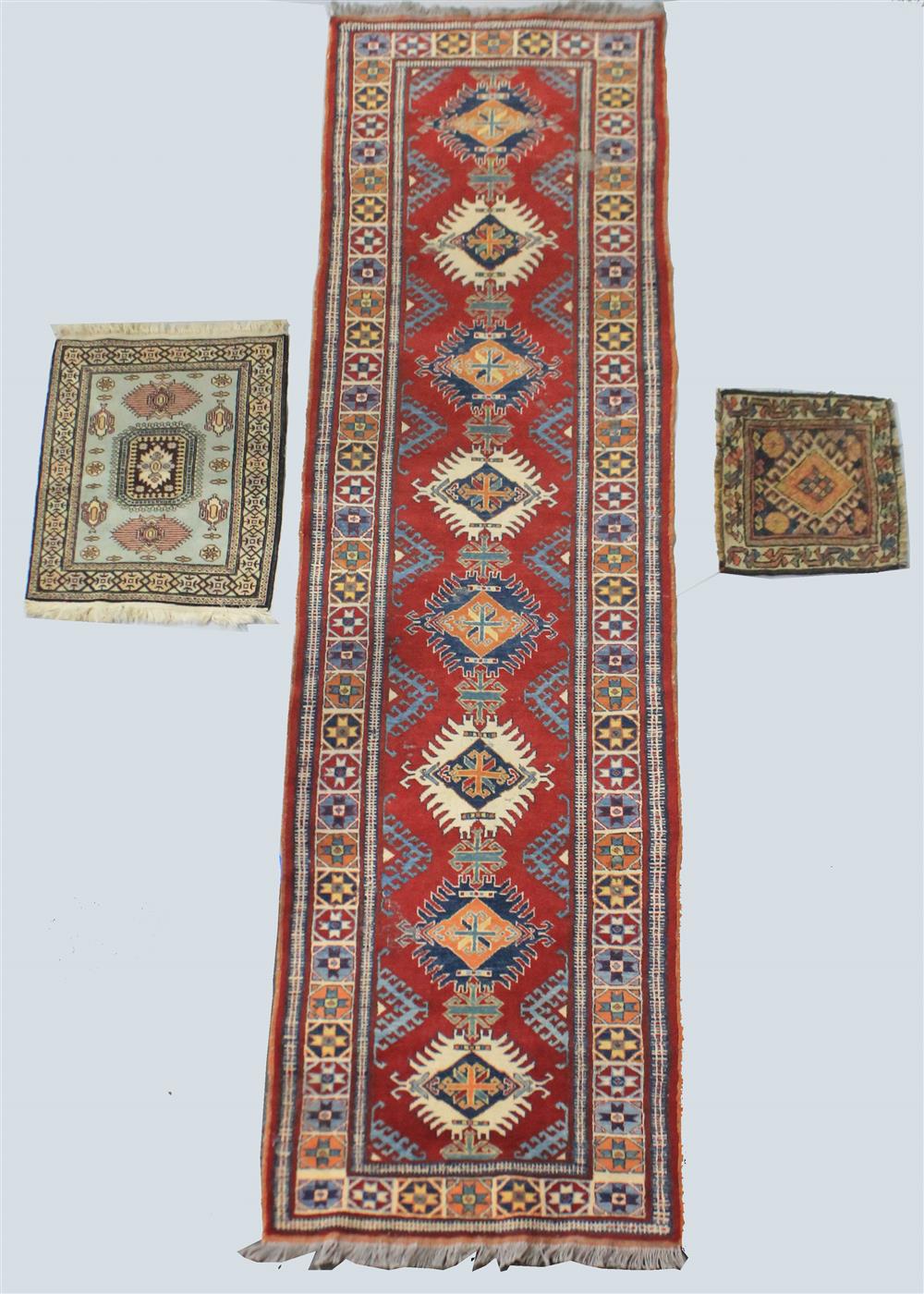 Appraisal: KAZAK RUNNER WITH TWO SMALL PERSIAN PAD RUGS having a