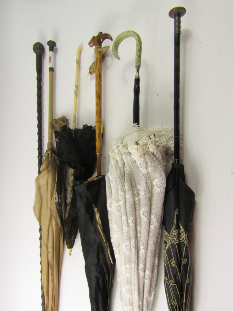 Appraisal: Victorian and later parasols an ebony and horn topped walking