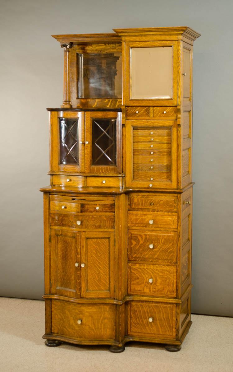 Appraisal: AN UPSCALE OAK SERPENTINE BREAKFRONT DENTAL CABINET American late th