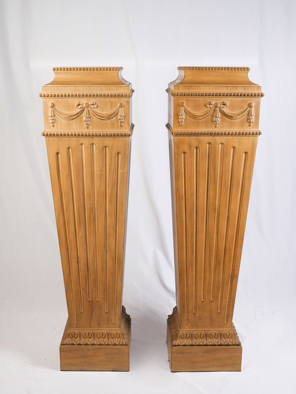 Appraisal: PAIR OF CARVED WOODEN PEDESTALS Both having a fluted tapered