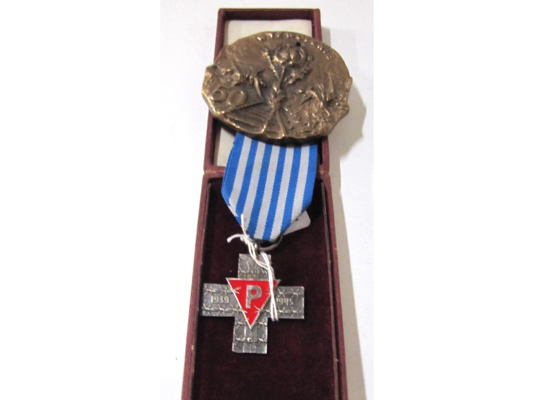 Appraisal: An Auschwitz concentration camp survivor's cross and medallion