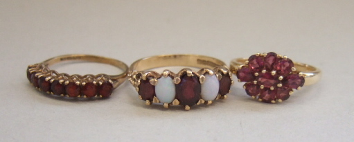 Appraisal: A ct gold opal and garnet set five stone ring