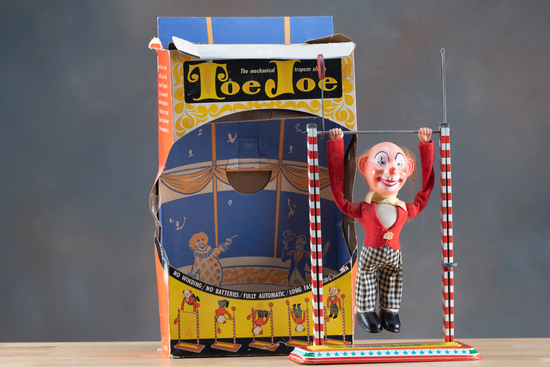 Appraisal: Vintage Mechanical Toy titled TOE JOE mechanical trapeze clown On