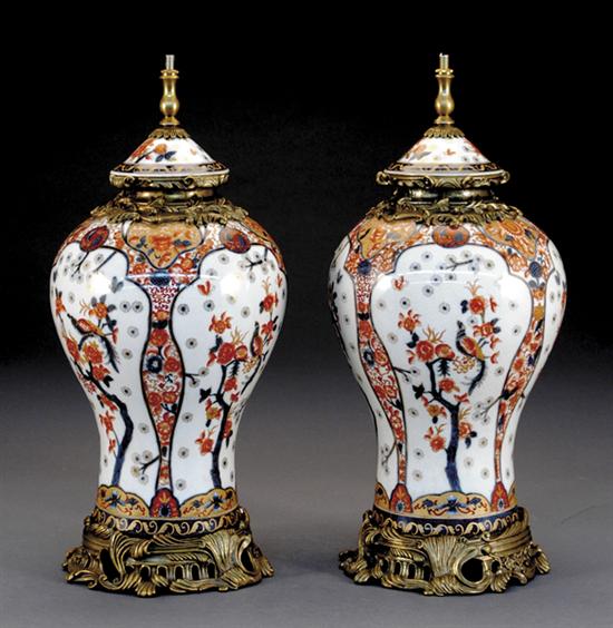 Appraisal: Pair metal-mounted Imari style urn-form lamps traditional iron red blue