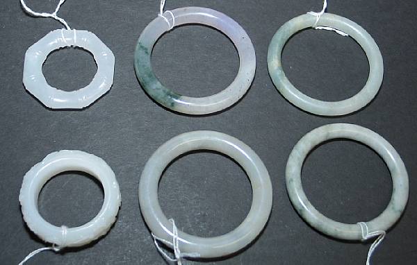 Appraisal: A group of six children's bangles Four of mottled jadeite