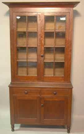 Appraisal: AMERICAN SHERATON CHERRY BOOKCASE the straight flared cornice above glazed