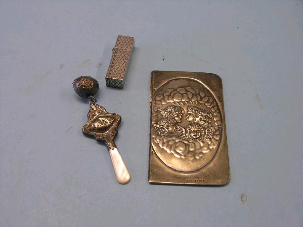 Appraisal: A silver and mother-of-pearl baby rattle Birmingham a silver book