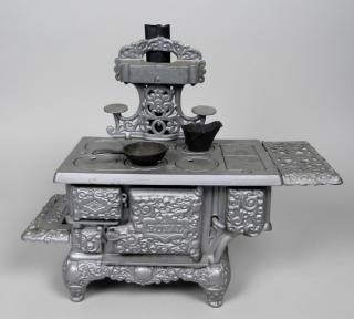 Appraisal: Royal Wood cast iron toy stove Royal Wood silver cast