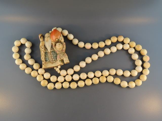 Appraisal: Chinese Carved Ivory Necklace includes polychrome netsuke ivory beads are