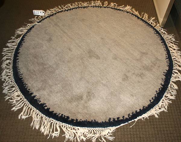 Appraisal: A Tibetan carpet size approximately ft in x ft size