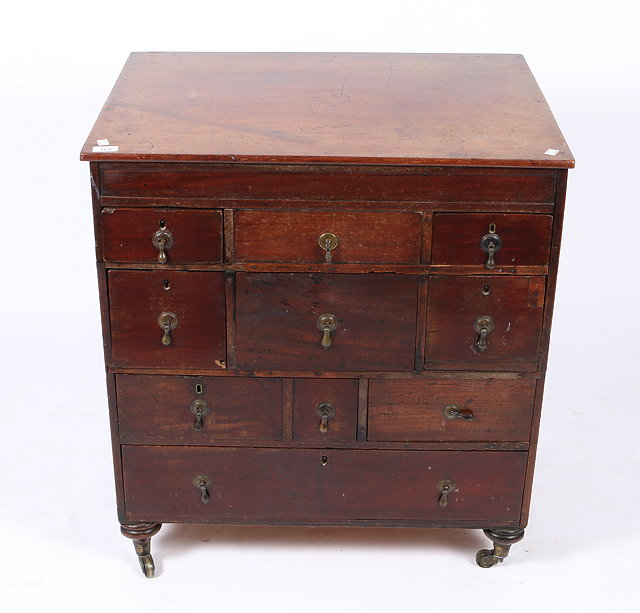 Appraisal: A MAHOGANY CHEST of various drawers each with drop handles