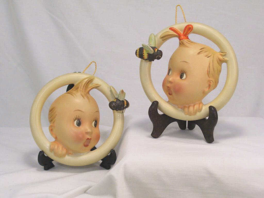 Appraisal: Pair Hanging Hummel Plaques Boy and girl plaques A B