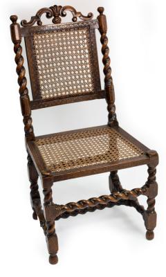 Appraisal: A Charles II walnut cane back side chair with scroll