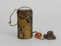 Appraisal: A Japanese Laquer Inro with a Manju Netsuke Four-compartment lacquer