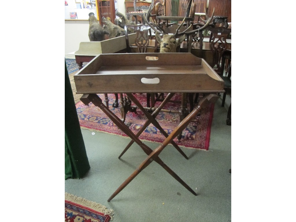 Appraisal: th century oak butlers tray on a folding stand Provenance