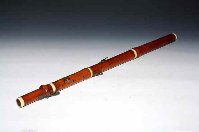 Appraisal: AN APPLEWOOD AND IVORY FLUTE by C S Barfoot Blandford