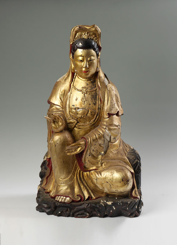 Appraisal: CHINESE CARVED GILT DECORATED GUANYIN Antique figure of seated Guanyin